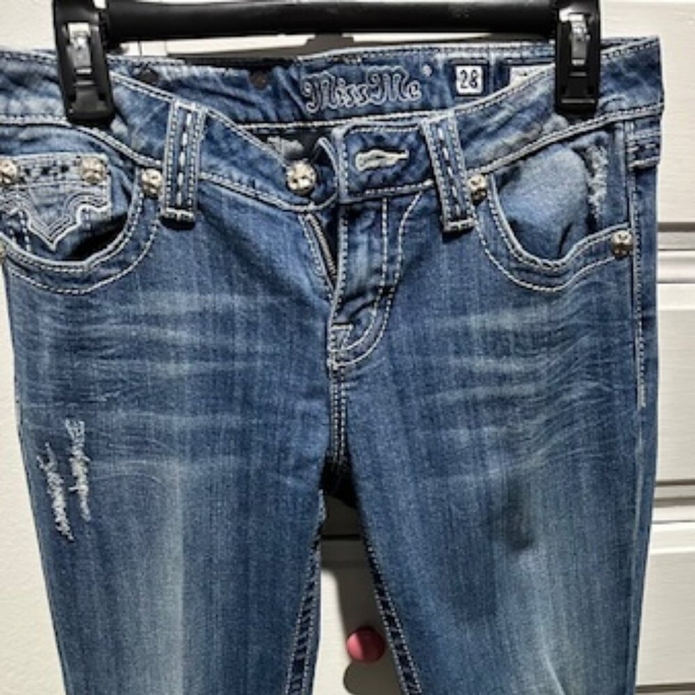 Women's Miss Me Jeans with black and white cow print pockets